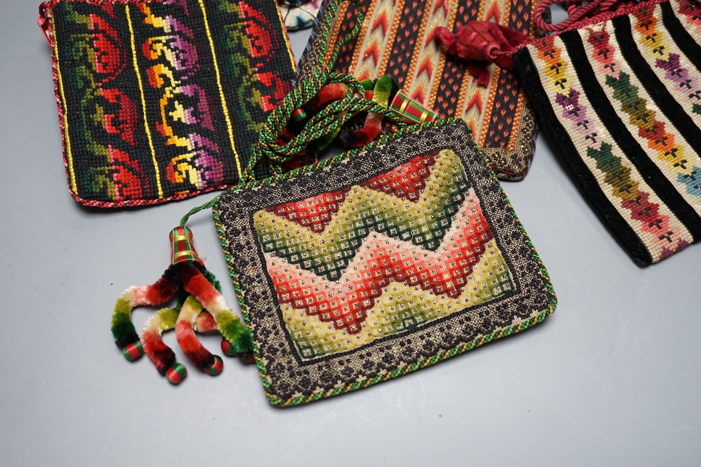 Ten 19th century embroidered and woolworked bible bags, largest 18 x 16cm